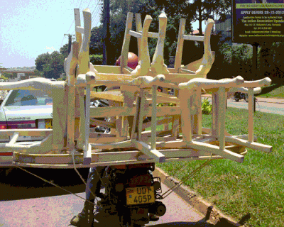 Boda bodas are the main form of transport in Uganda: for people, chickens, goats, three piece sofas - and even coffins! boda boda Kampala Uganda chairs