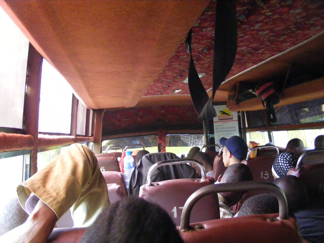 Just don't sit on the back seat! Bus from Kampala to Kigali