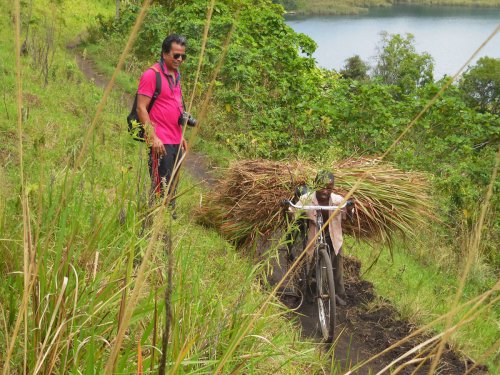 crater-rim-walk-boy-with-bike-kyaninga-lodge-fort-portal