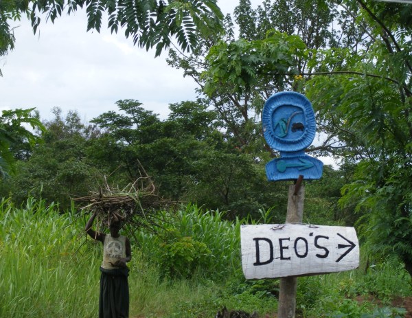 Signpost to Deo's community tourism project Ishasha Signpost to Deo's community tourism project Ishasha