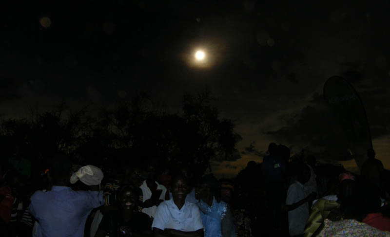 Diary of a Muzungu's very amateur photo of Uganda's hybrid solar eclipse, Pokwero People watching hybrid solar eclipse Uganda, Pokwero