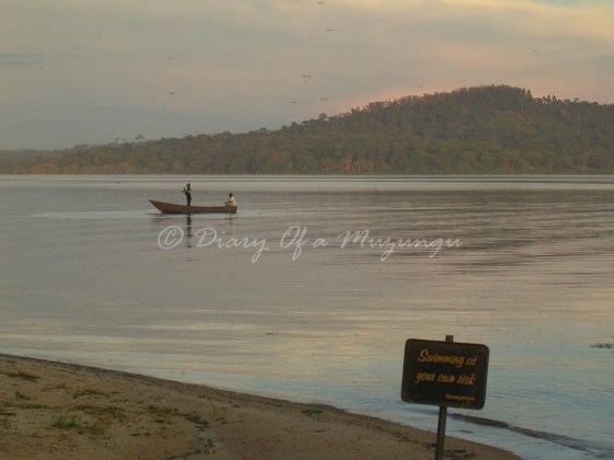 A fisherman passes the beach at Munyonyo, Lake Victoria A fisherman passes the beach at Munyonyo, Lake Victoria - why I love Uganda