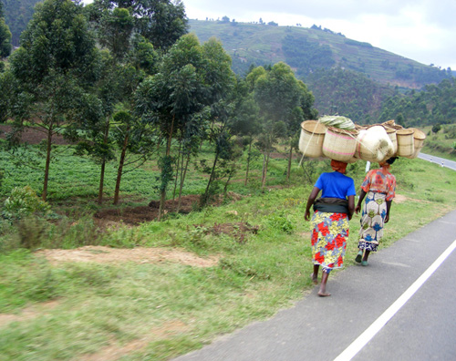 Local women carrying handwoven baskets along the vastly improved A roads between Kisoro and Mbarara, south western Uganda Local women carrying handwoven baskets near Kisoro